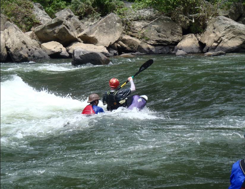 Mikel and Corey Carr surfing in Swimmers Rapid.